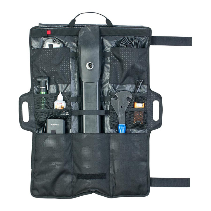 Evoc Gear Wrap holding tools 